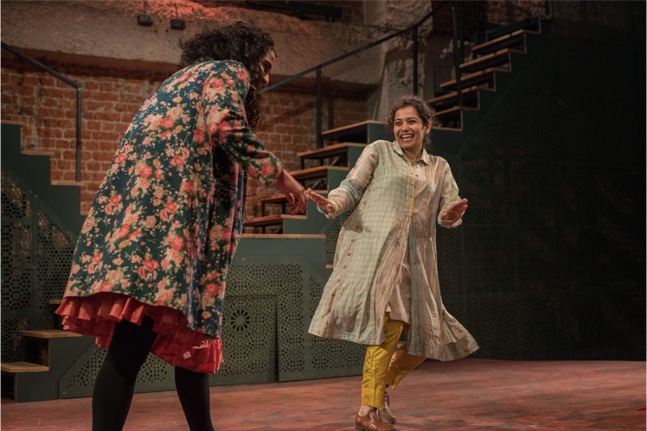 Two actors perform a scene from The Monsoon Wedding Musical during the grand opening of Qatar-India 2019.