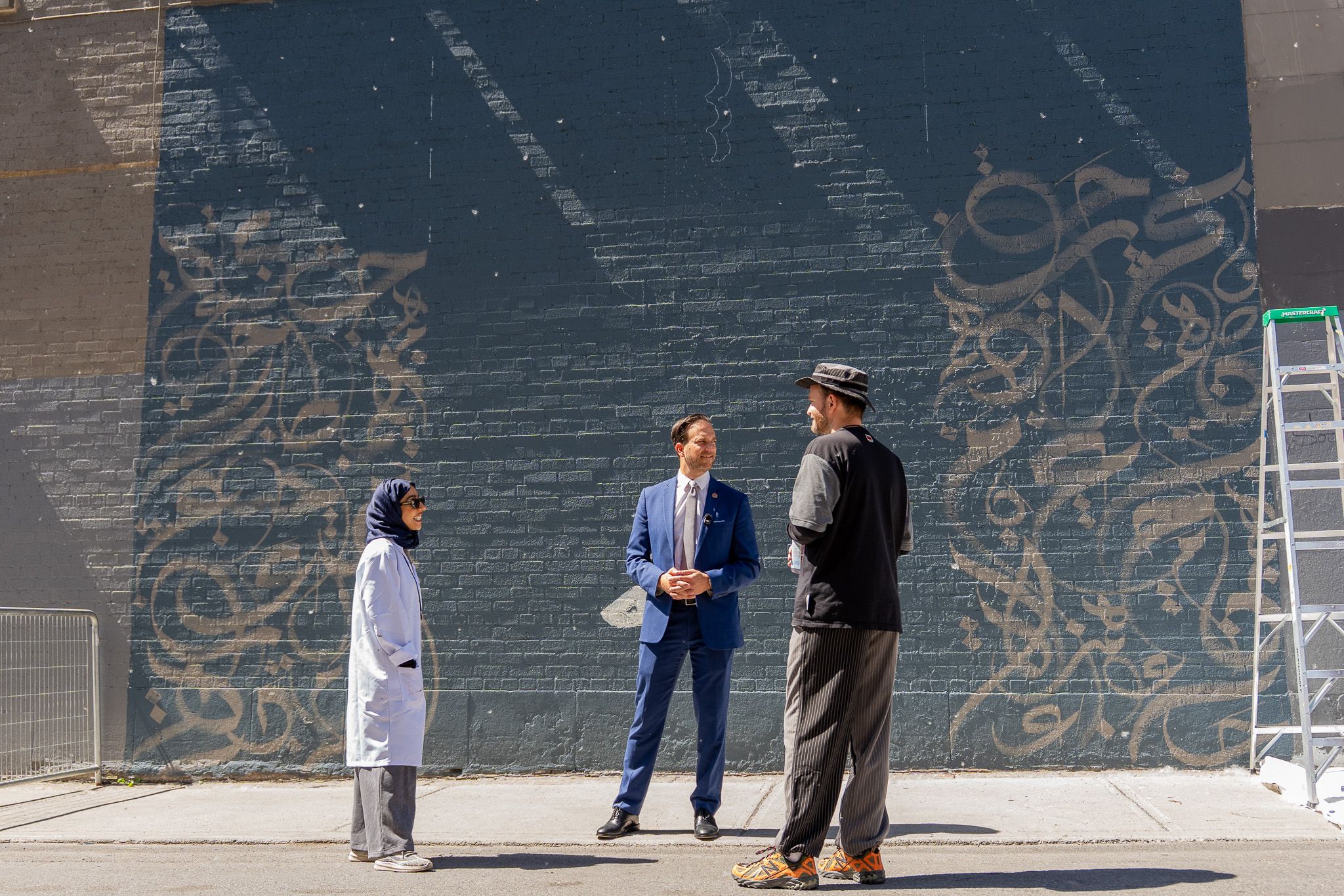 Fatima Alsharshania and Canada's Ambassador to Qatar Karem Morco (middle).jpg