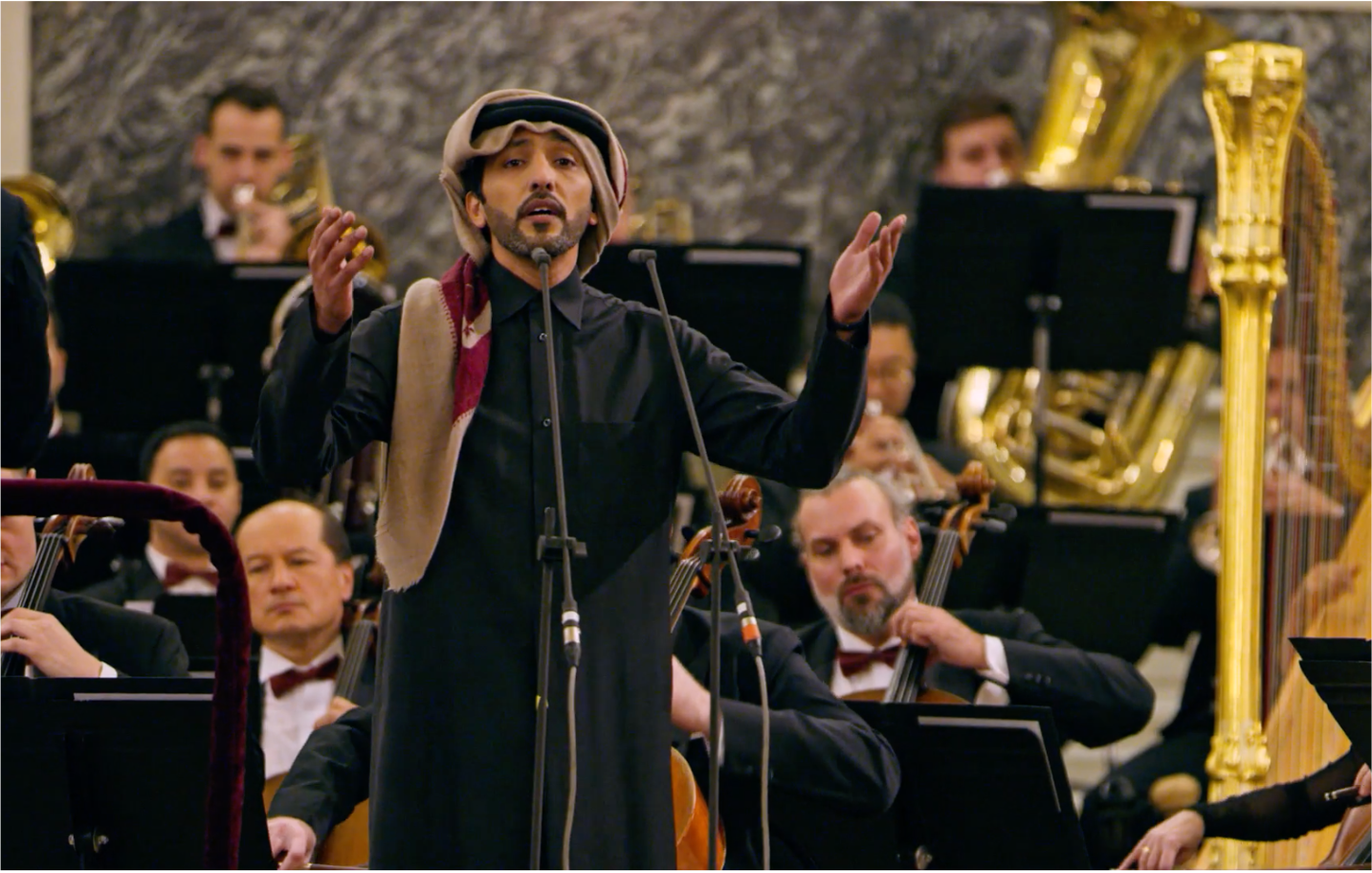 Middle Eastern man sings with an orchestra at the VII International Cultural Forum during Qatar-Russia 2018 Year of Culture.