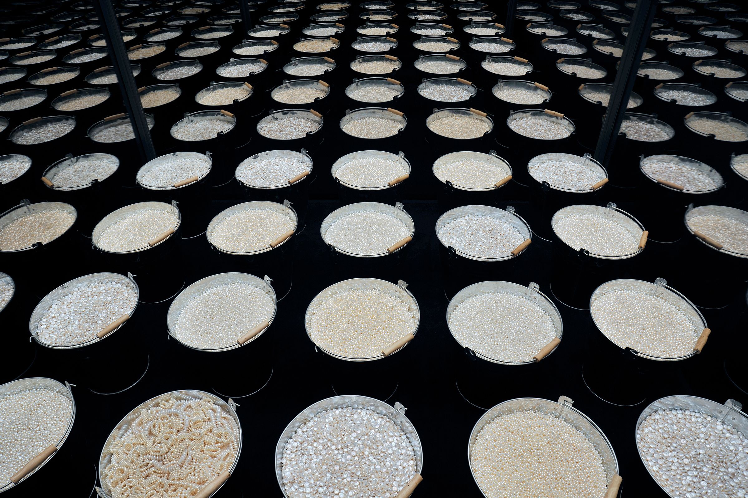 Containers filled with different kinds of pearls on display at the Pearls Exhibition in Sao Paulo, Brazil.