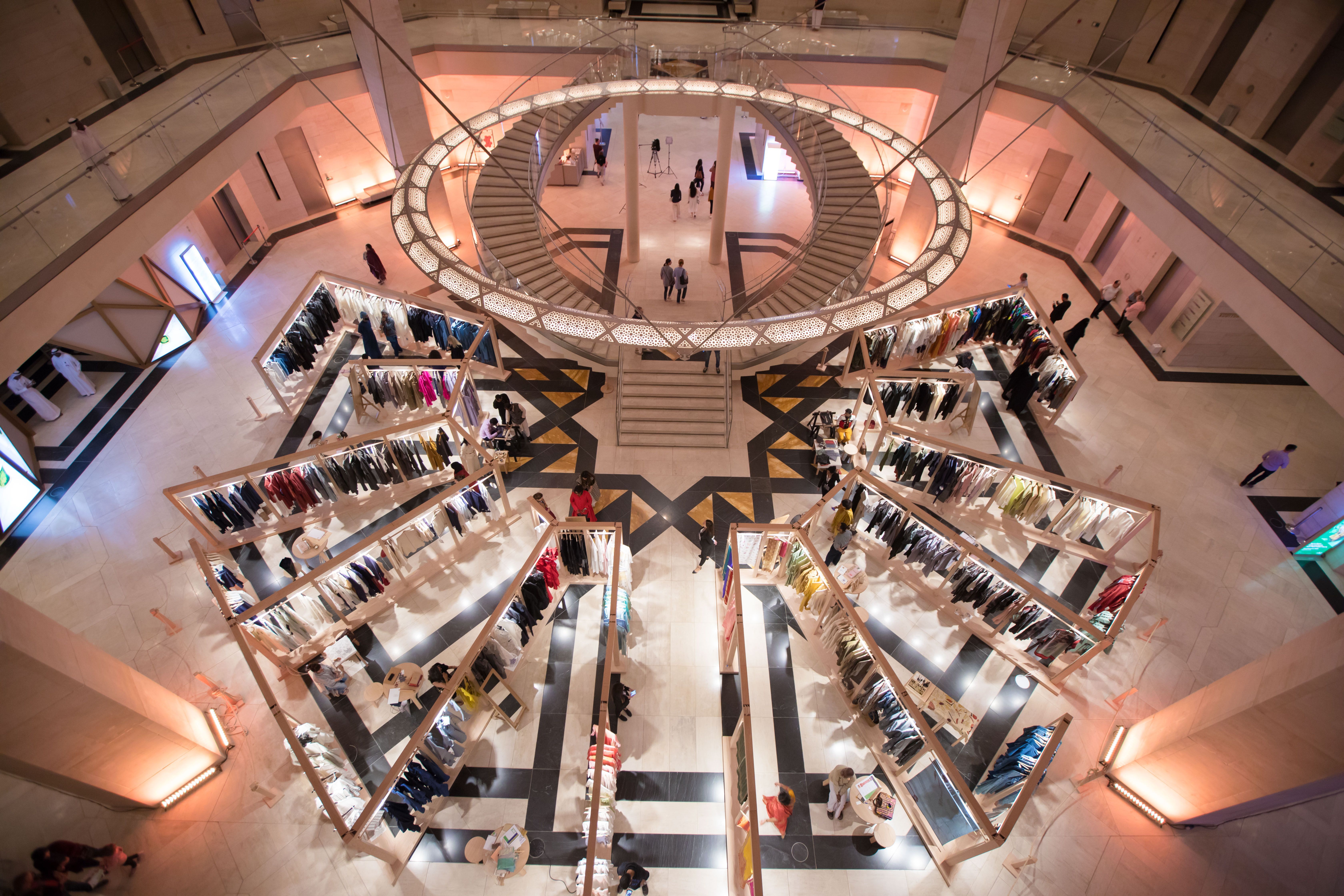 Seen from above, a selection of contemporary Indian fashion and textiles displayed at the Museum of Islamic Art in Doha.