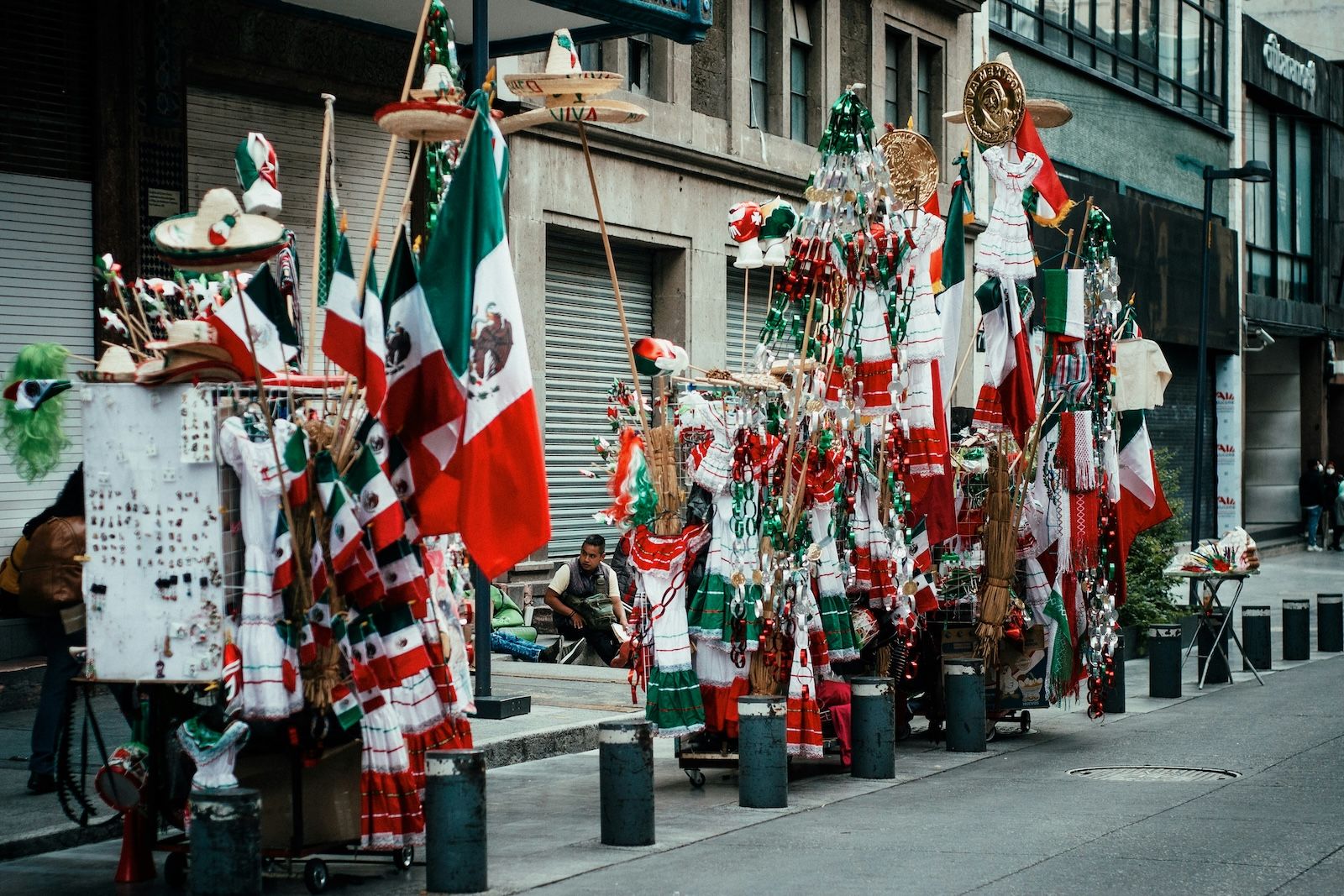 street vendor in mexico selling patriotic items in celebration of mexican independence day