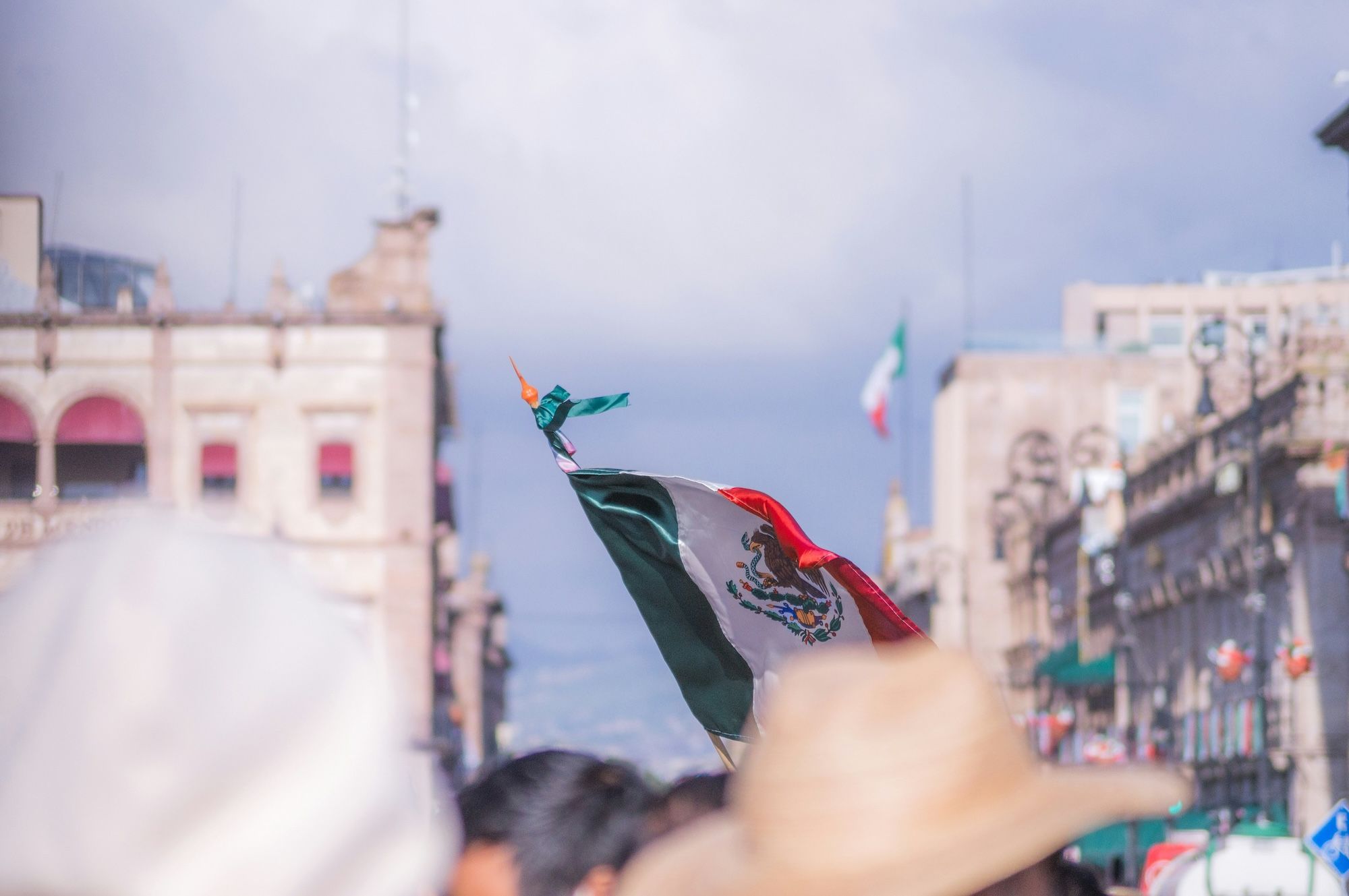 detail of a raised mexican flag during the mexican independence day celebrations