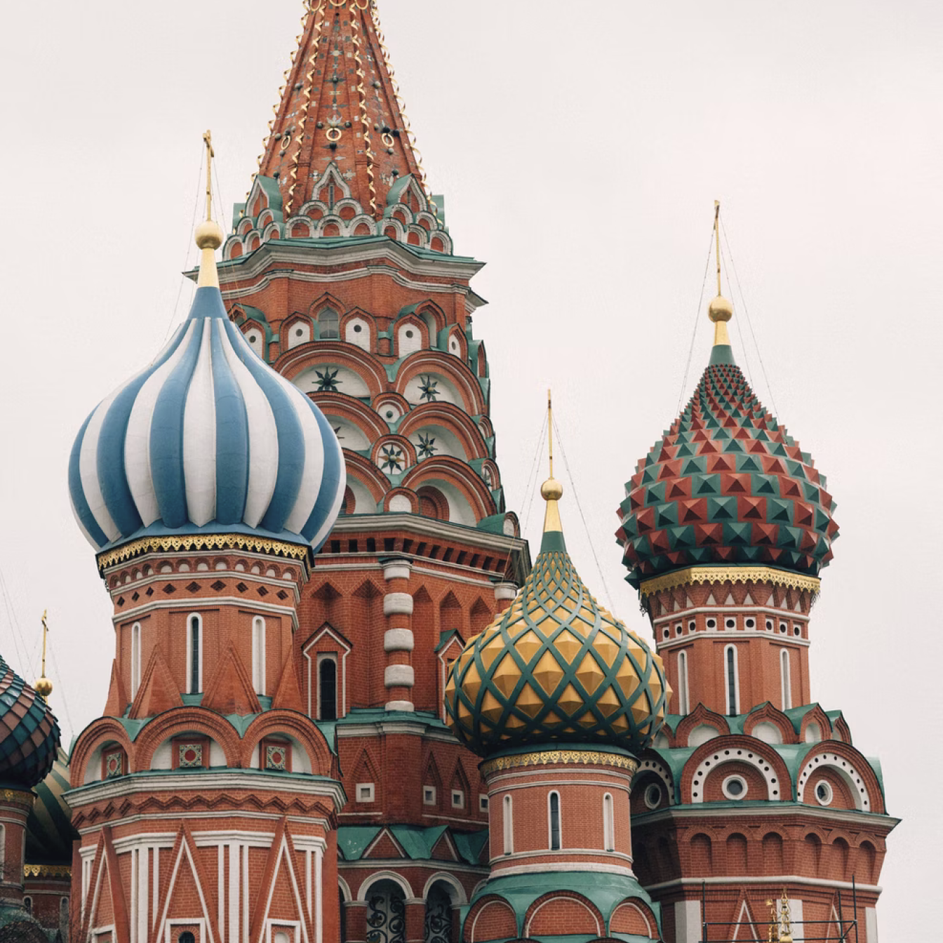 Saint Basil's Cathedral in Moscow, an Orthodox church with elaborate red towers and brightly painted onion shaped domes.