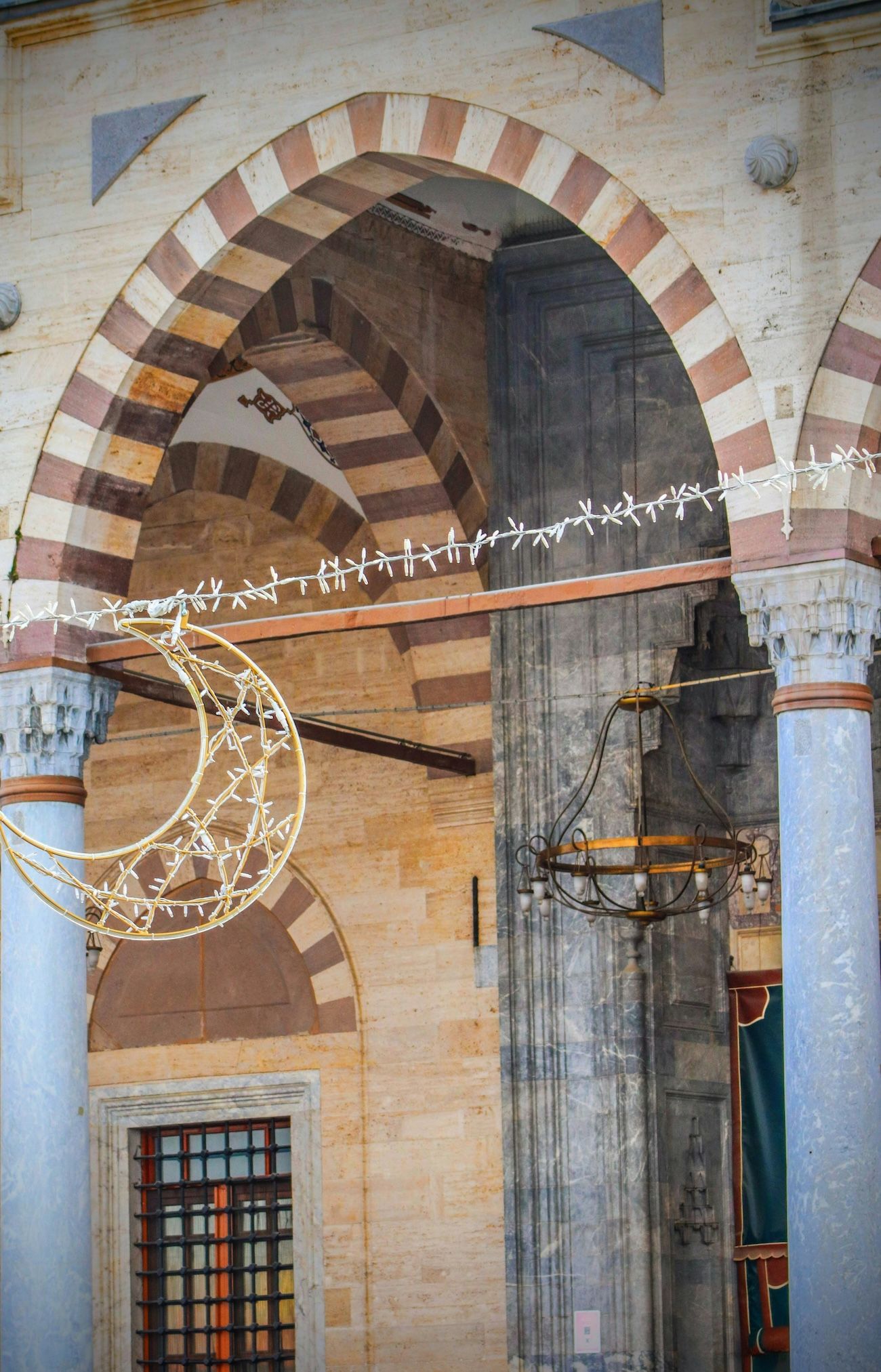 A crescent moon-shaped lighting element, used to decorate a Mosque during the Ramadan month.