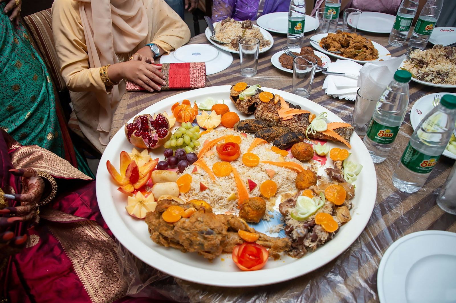 Typical Iftar meal with a main large common plate to emphasise the importance of togetherness and hospitality during Ramadan.