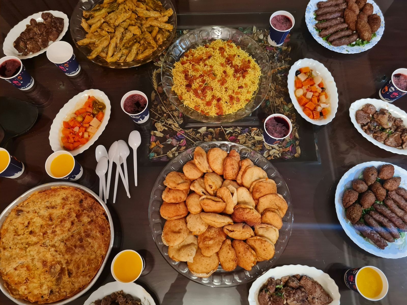 A large, communal meal, typical of an Iftar, which is the evening meal eaten by Muslims to break their fast during the Ramadan.