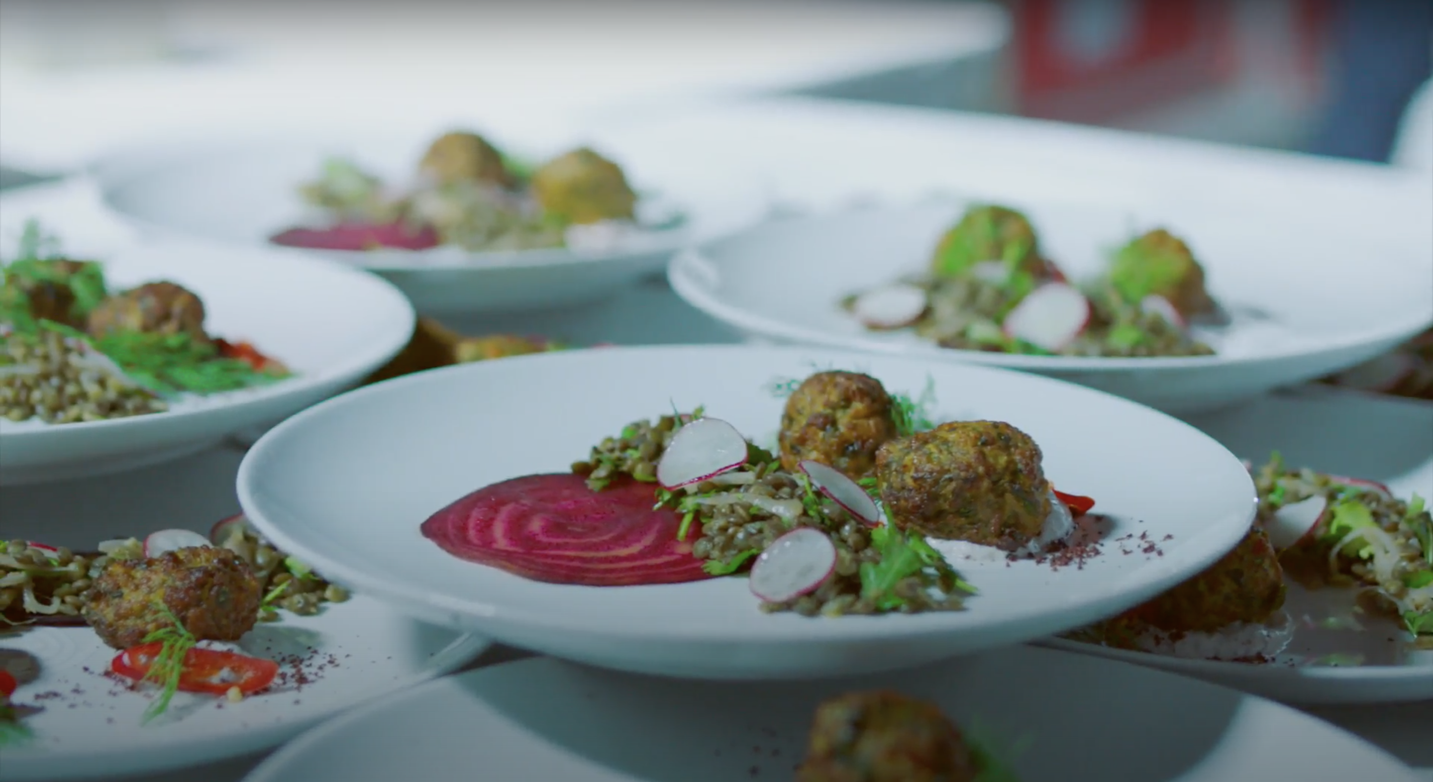Plated appetisers with a slice of beetroot and salad by Sami Tamimi for Years of Culture Opening ceremony.