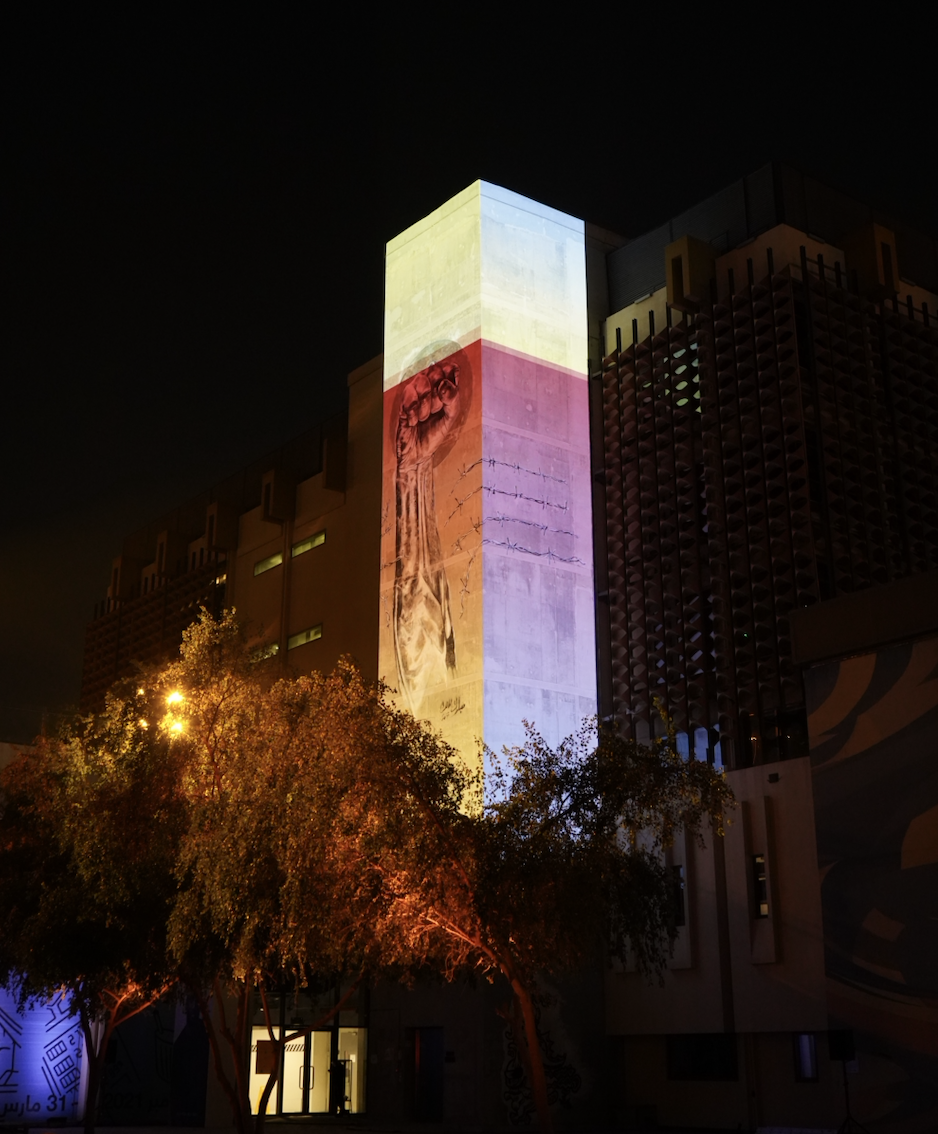 Light projections on the tower of the Fire Station in Doha, on the night of the Years of Culture opening ceremony event.
