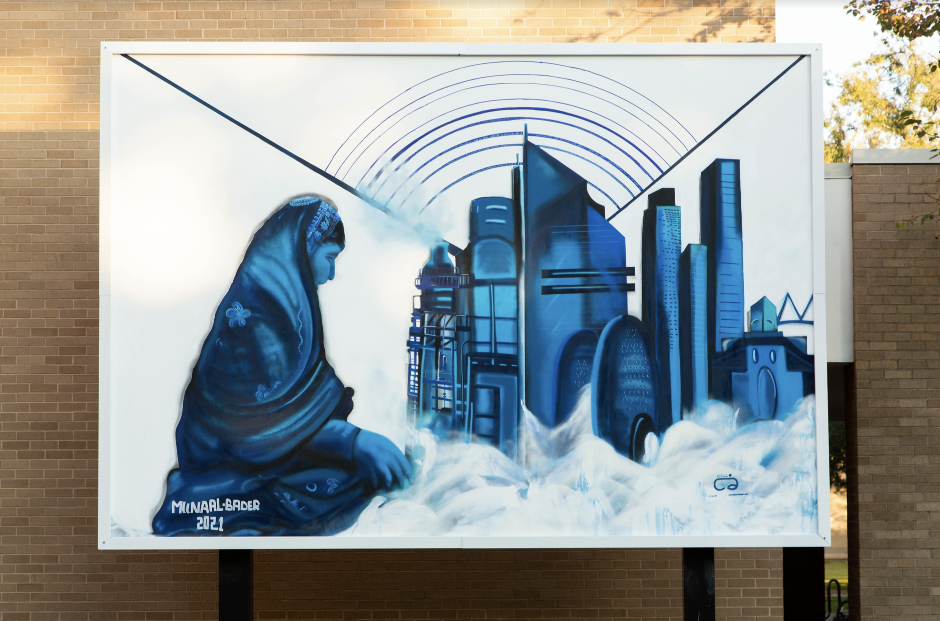 A large scale mural painted in shades of blue on a white background during JEDARIART in Houston.