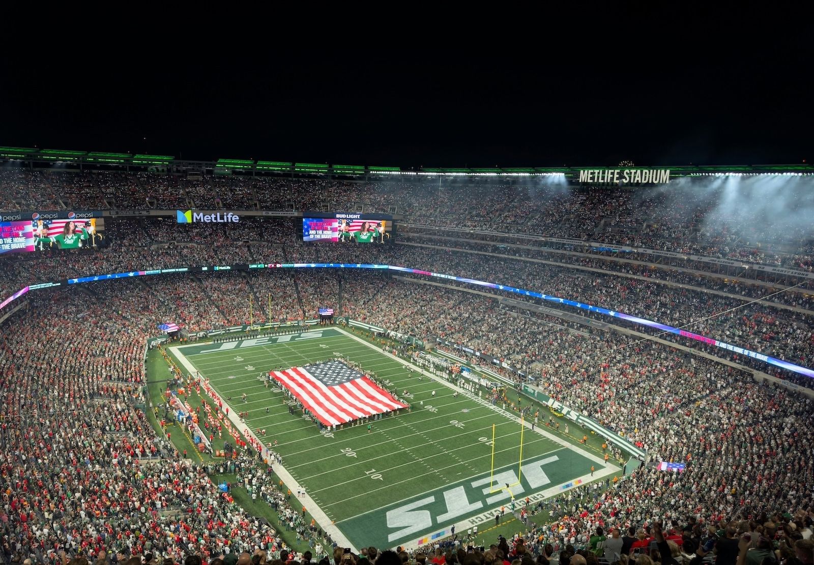 MetLife Stadium with a giant American flag on the pitch