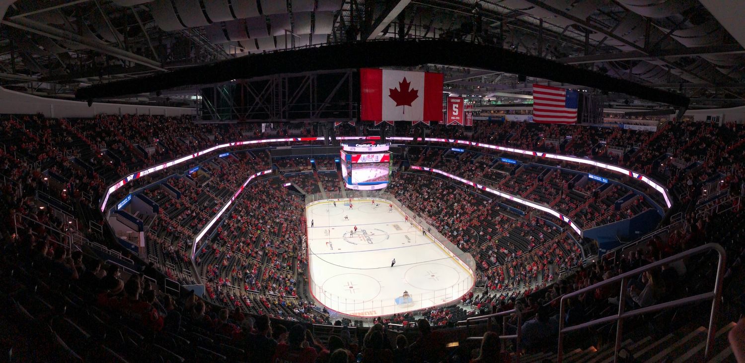Canadian flag flying above the ice rink during an NHL match.