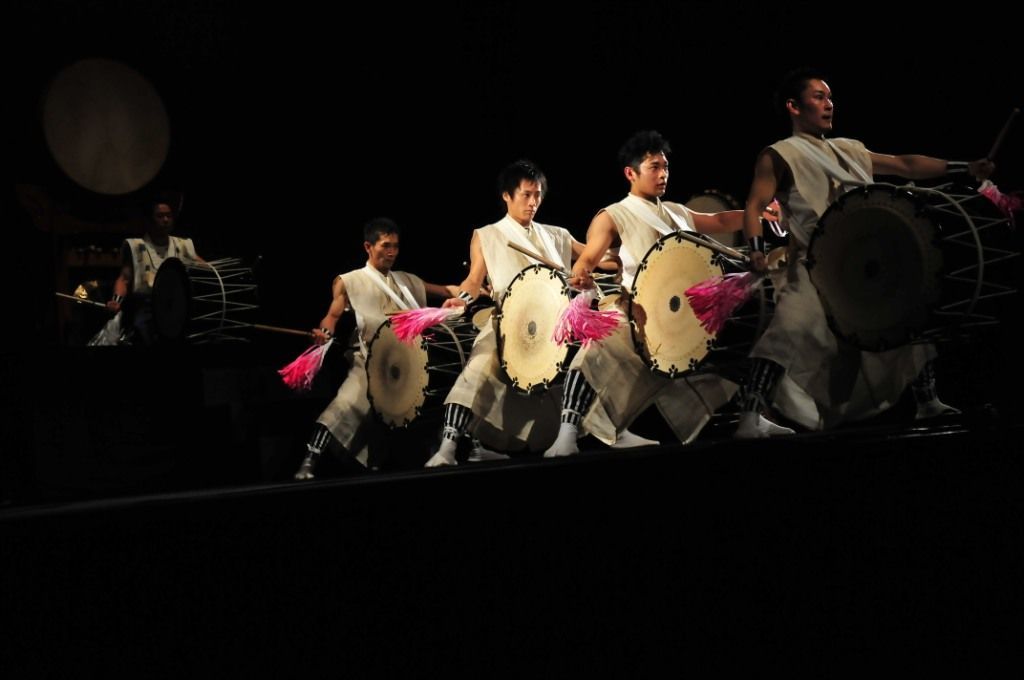 Five Japanese men perform on stage, playing traditional Japanese drums during the Qatar-Japan 2012 Year of Culture.