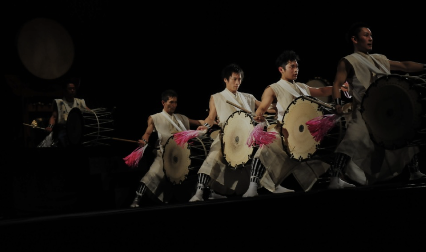 Five Japanese men perform on stage, playing traditional Taiko drums during the Qatar-Japan 2012 Year of Culture.